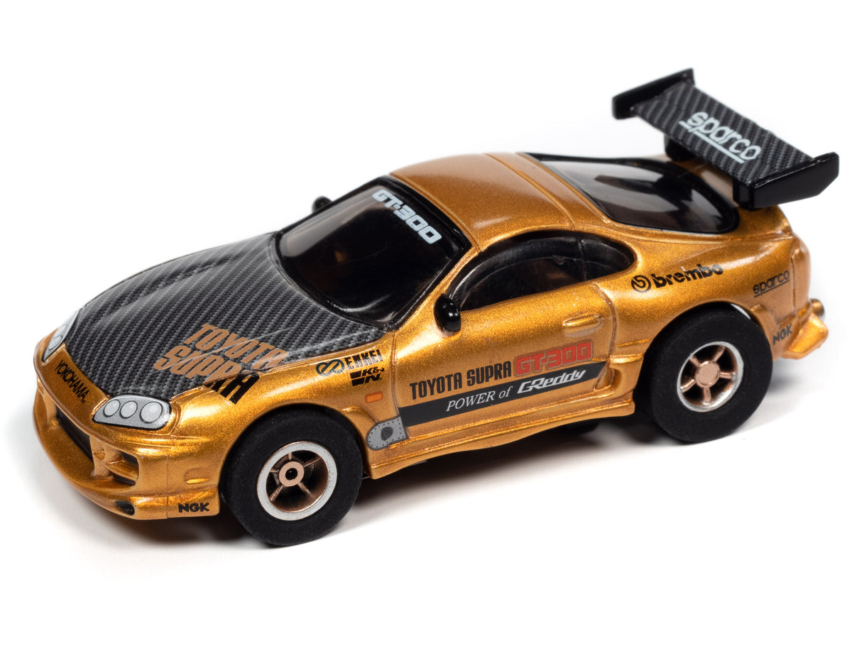 Gold and black Toyota Supra race car model for slot car racing for Auto World SRS342