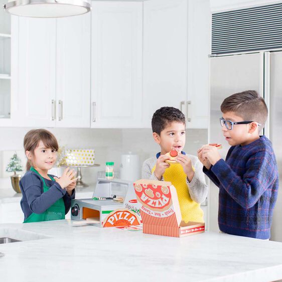 Kids play with wooden pizza set at a kitchen counter for Melissa and Doug 9465