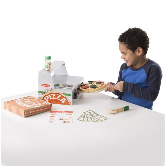 Child plays with wooden pizza counter and play food set for Melissa and Doug 9465