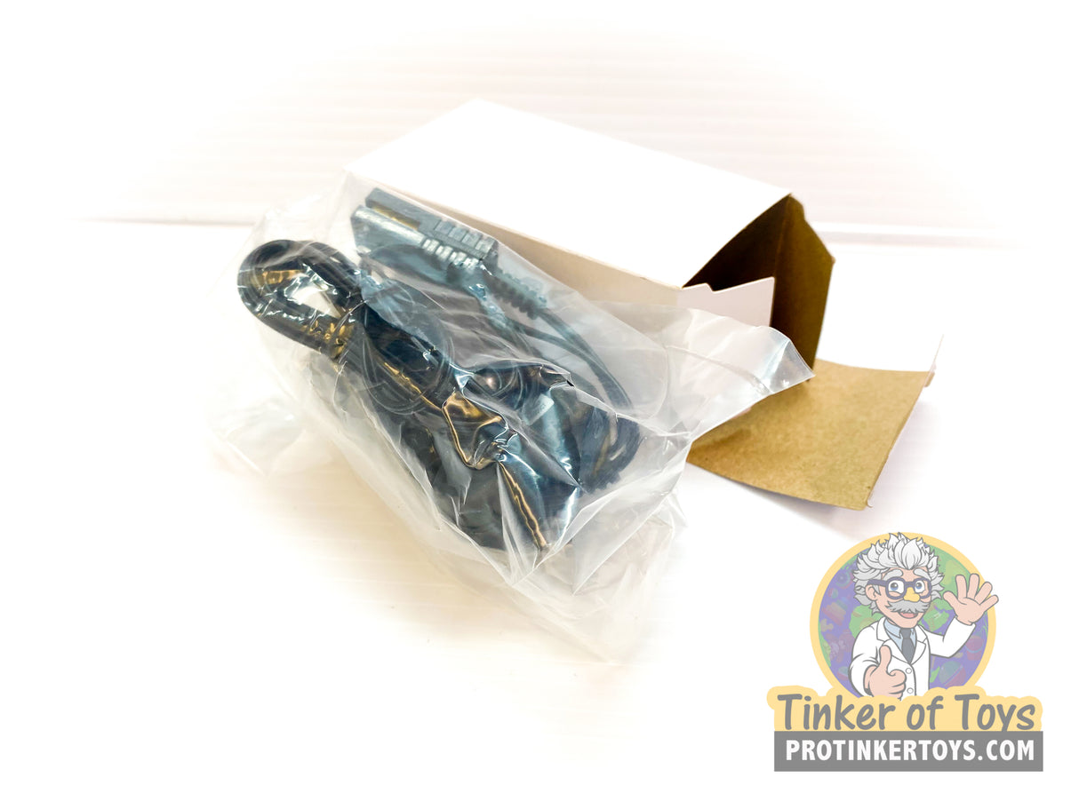Transformer accessories in clear packaging with a cardboard box for Auto World TRX00144