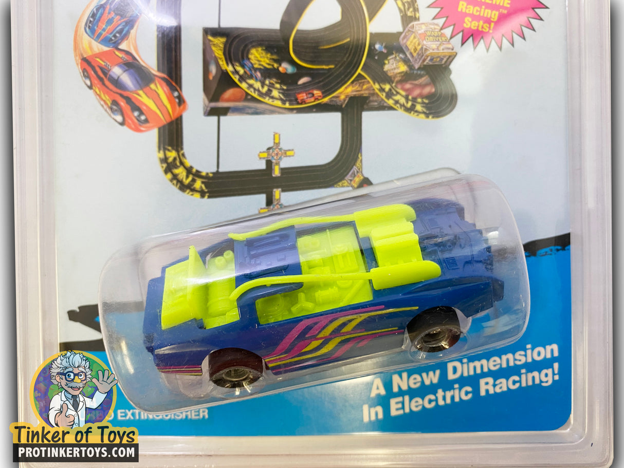 Blue and yellow toy race car in clear plastic packaging for Tyco 6494