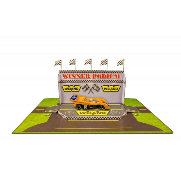 Model kit of a winner's podium with a race car display for Innovative Hobby Supply BK6427