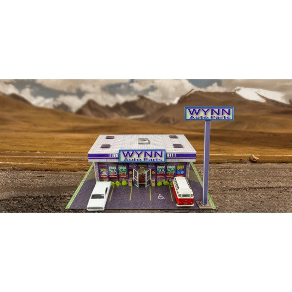 Model kit of an auto parts store with two cars parked in front for Innovative Hobby Supply BK6435