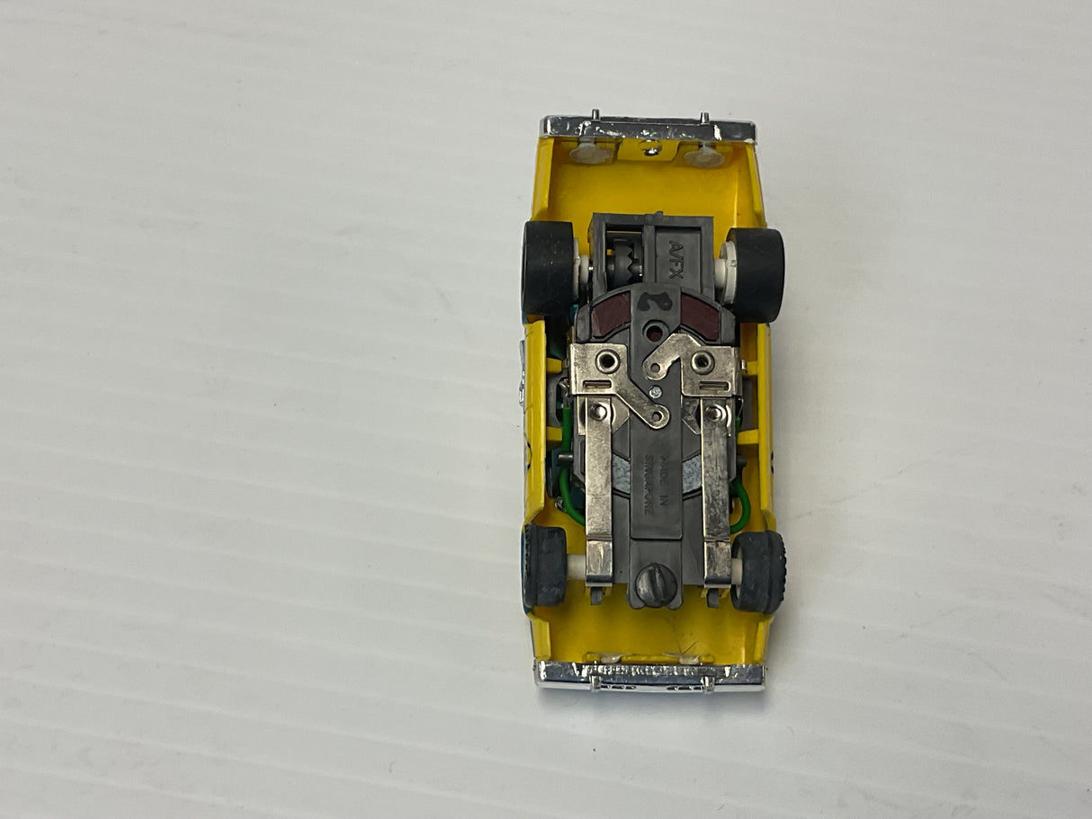 Aurora AFX maga-traction Chevy pursuit car with overhead roof lights blue, and yellow | 1979 | Aurora - AFX