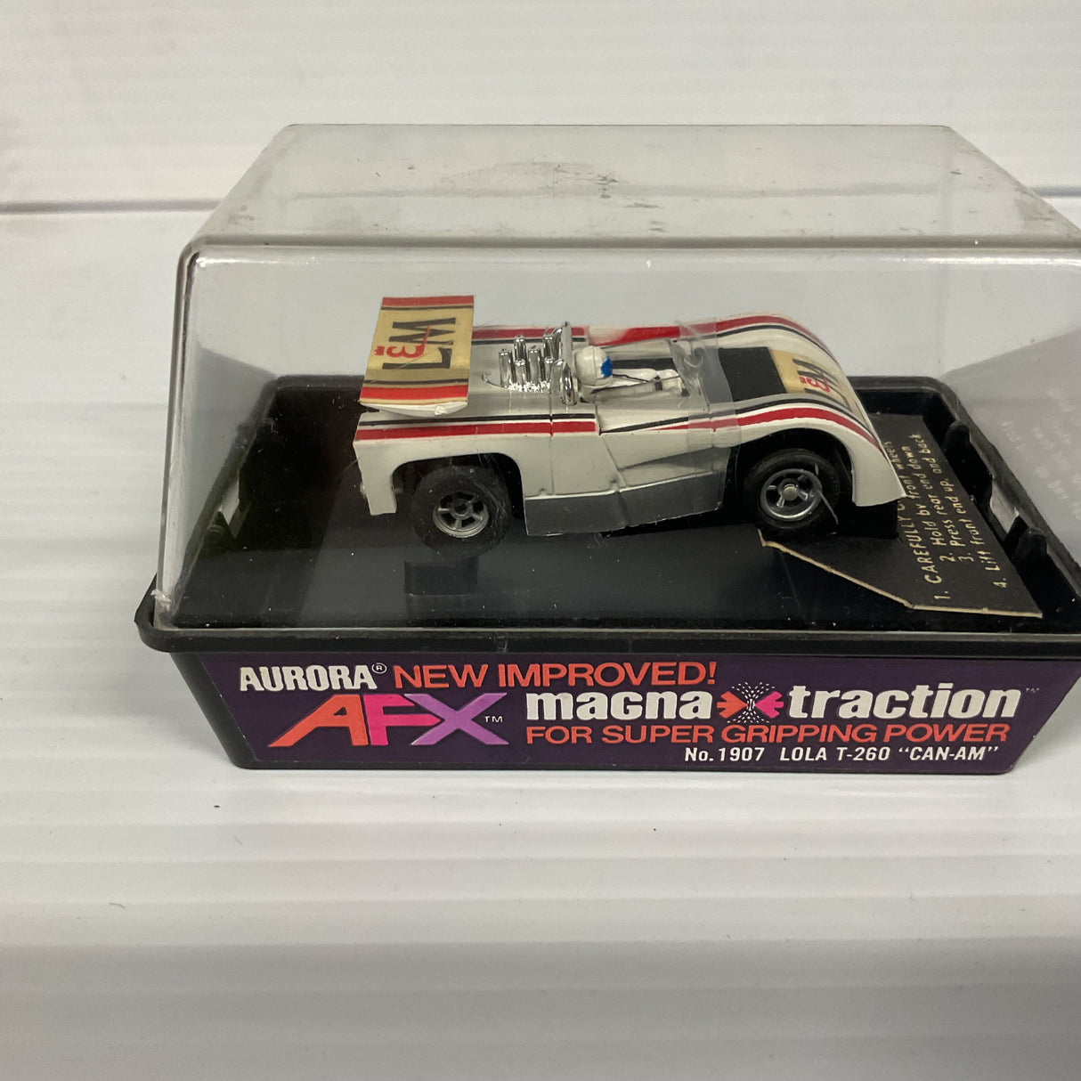 Aurora AFX magnatraction Lola T-260 "Can-Am" | 1907 | Aurora - AFX