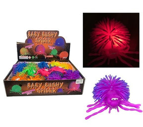 Colorful, fuzzy spider toy in a box, with a separate purple version for Handee NV3621