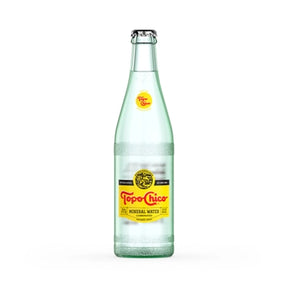 Clear glass bottle of Topo Chico mineral water for Coca-Cola 155205