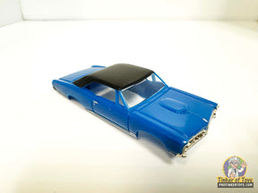 Blue 1967 GTO slot car with a black vinyl top for Model Motoring MM06020