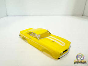 Yellow 1969 Yenko Camaro slot car with white racing stripes for Model Motoring MM12091, front view