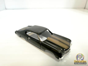 Black slot car of a 1970 Chevelle SS with gold stripes for Model Motoring MM13013, front view