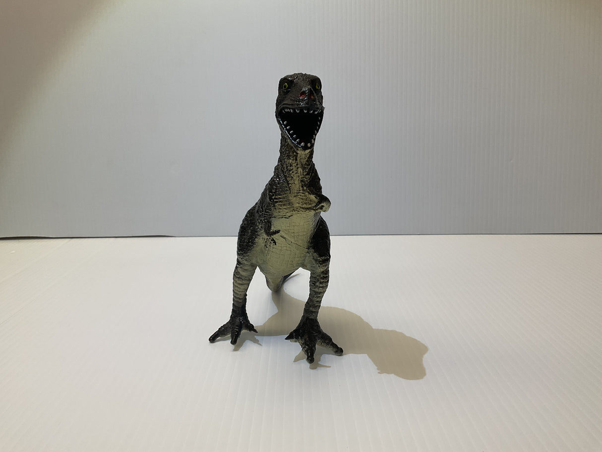 Dinosaur toy figure with open mouth, standing on a white surface for Mamejo MAJ33000