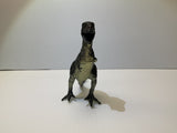 Dinosaur toy figure with open mouth, standing on a white surface for Mamejo MAJ33000