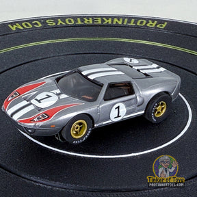 Silver Ford GT slot car with black and red racing stripes for Auto World CP7989, front view
