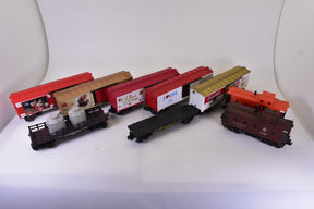 Assortment of O gauge train cars, including freight and passenger cars for Lionel