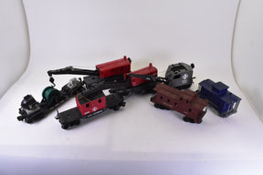 Assortment of O gauge train rolling stock, including locomotives and cars for Lionel, front view