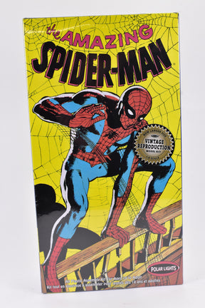 Spider-Man model kit box art featuring the superhero in a web-slinging pose for Polar Lights 04100