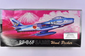 Model kit box art featuring a blue and white RF-86F Sabre jet against a pink mountain backdrop for Kangnam Model F-20
