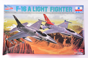 Two F-16 fighter models in a desert landscape setting for ESCI