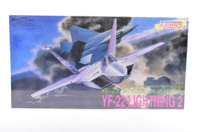 Model kit box art featuring a detailed rendering of the YF-22 Lightning 2 fighter jet for Dragon