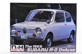White 1969 Subaru R-2 Deluxe model kit viewed from the front three-quarter angle for Nostalgic Heroes NH-22