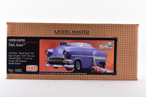 Model kit box art showing a purple 1950s car model for Testors Del Aire 1/32 Scale