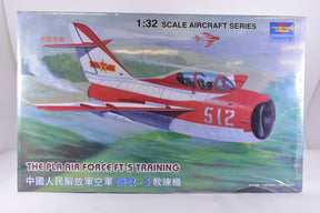 Model kit box art: Red and white jet trainer aircraft on a green landscape for Trumpeter 02203