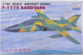 Green and yellow F-111E Aardvark jet model on a blue sky background for Mini Hobby
