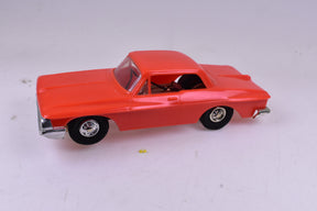 Orange 1/32 scale slot car of a 1963 Dodge for Eldon 1024, front view