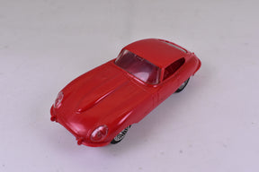 Red slot car of a vintage Jaguar XKE for STROMBECKER, front view