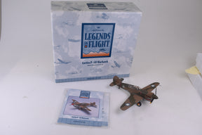Curtiss P-40 Warhawk model kit box and assembled replica airplane for Hallmark QHA1000