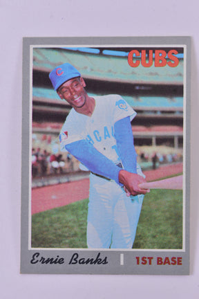 Ernie Banks in a Cubs uniform, ready to play first base for TAH Collection Topps 630