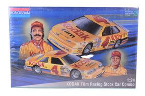 Model kit box featuring three yellow and black race cars and two men for Monogram 6367