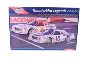 Two vintage Thunderbird race cars on a track backdrop for Revell Monogram 85-6857