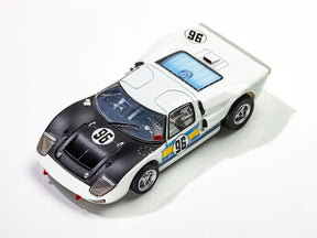 White and black Ford GT40 race car model with blue and gold accents for AFX/Racemasters 22057, front view