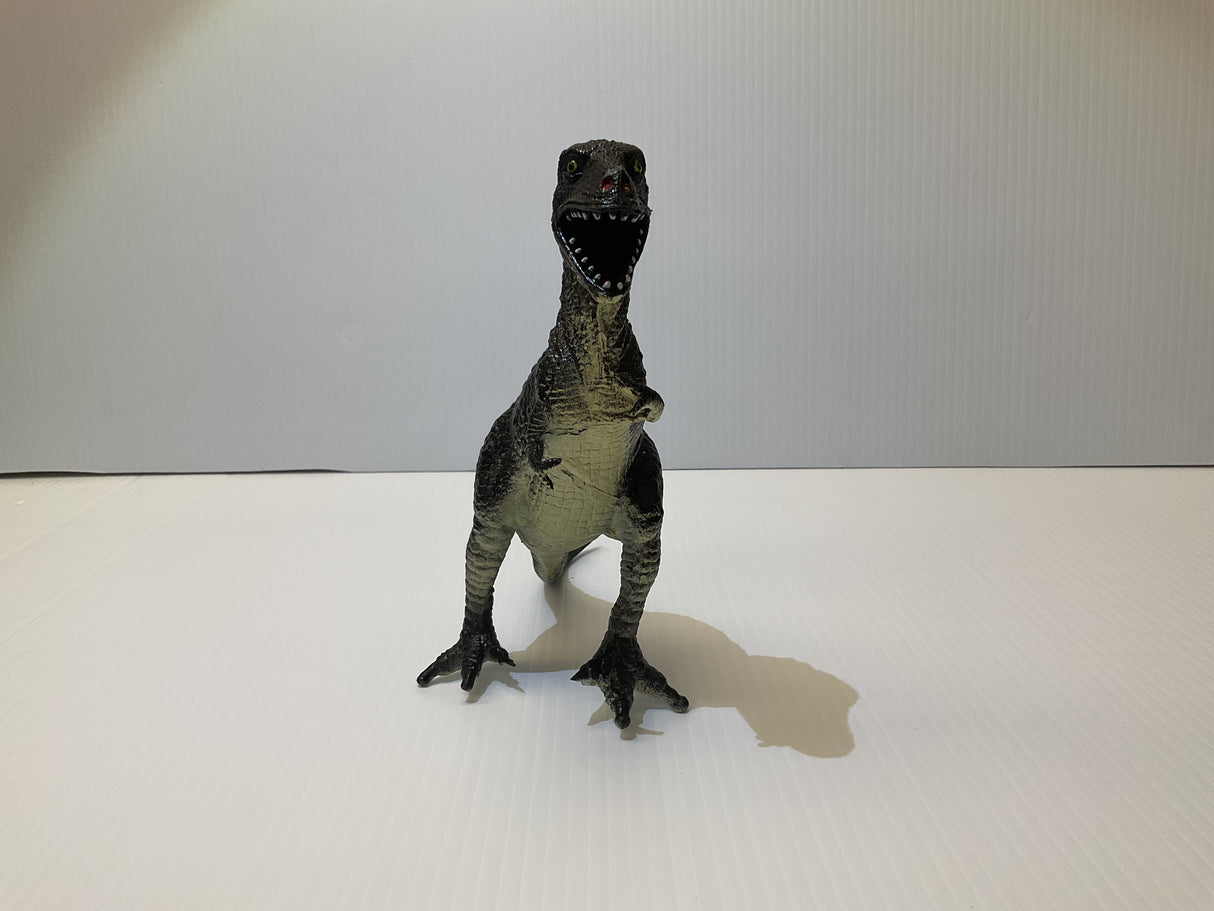 Dinosaur toy figure standing on a white surface for Mamejo MAJ33000