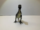 Dinosaur toy figure standing on a white surface for Mamejo MAJ33000