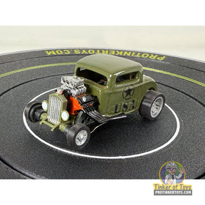 Green 32 Coupe Hot Rod with U.S. Army markings on a black disc for Extreme 3D Customs Extreme 3D Customs