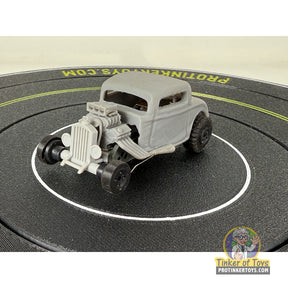 Unpainted 32 Coupe Hot Rod with backroad tires on a black surface for Extreme 3D Customs Extreme 3D Customs