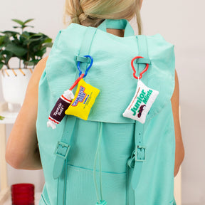 Backpack with three attached fun-sized plush keychains: toothie, candy, and junior mints for Schylling 33105