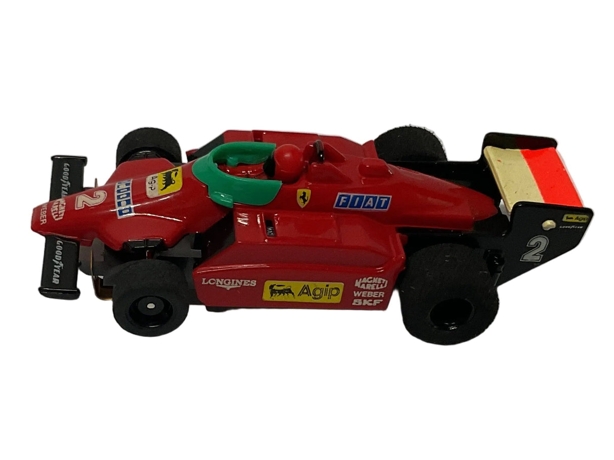 Red Fiat F1 race car toy with black wheels and green accents for Tyco B9979