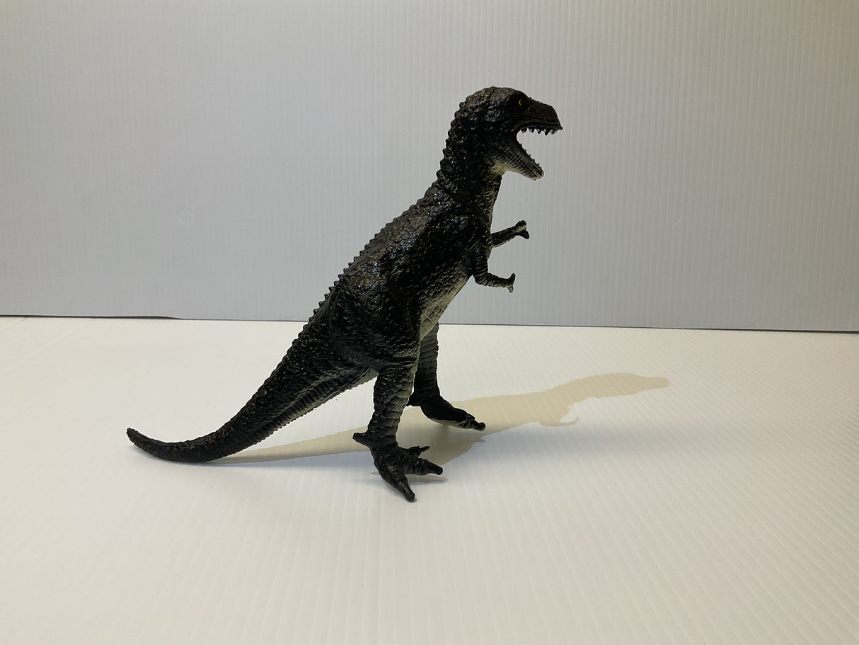 Black T-Rex toy dinosaur figure standing on a white surface for Mamejo MAJ33000
