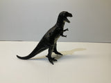 Black T-Rex toy dinosaur figure standing on a white surface for Mamejo MAJ33000