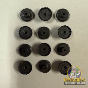 Assortment of black plastic gears and sprockets for Tyco 20405