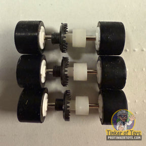 Three sets of black wheels and axles for a rear axle assembly for Tyco 6691