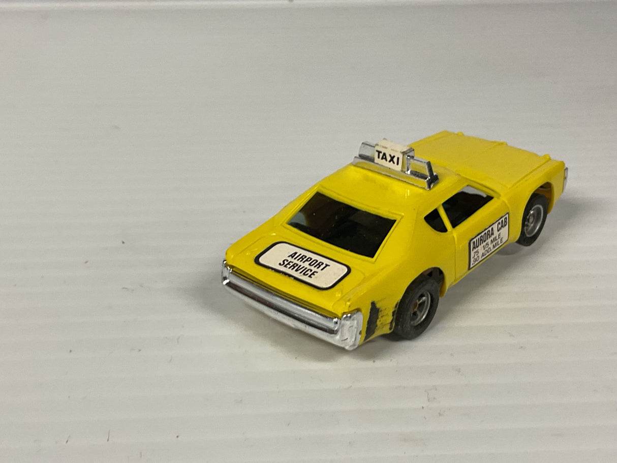 Aurora AFX non-magnatraction Matador Taxi Yellow w/scuff mark  | 1938 | Aurora - AFX