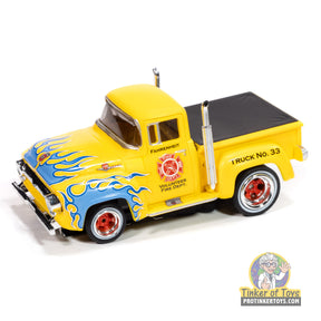Yellow 1956 Ford F100 fire truck toy with blue flames and "Volunteer Fire Dept." for Auto World SC414
