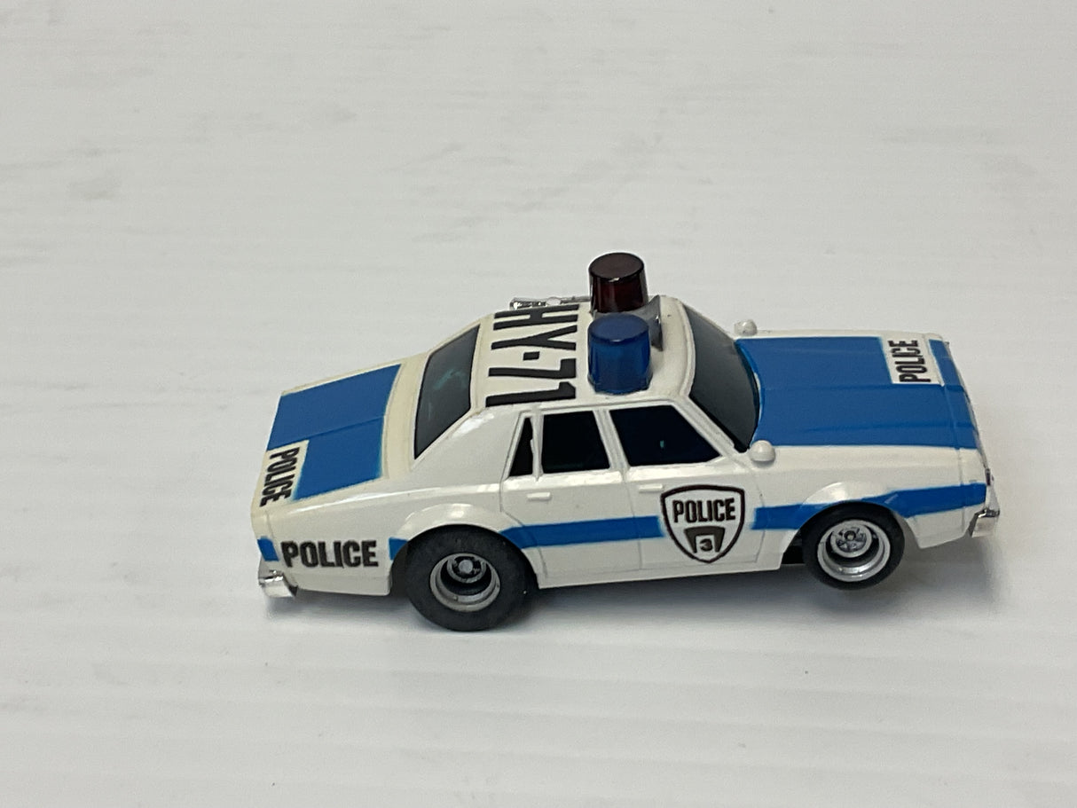 Aurora AFX maga-traction Chevy pursuit car with overhead roof lights blue, and white | 1979 | Aurora - AFX