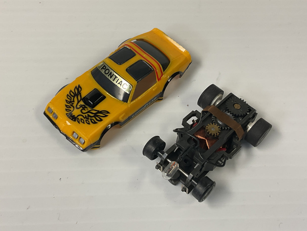 Tomy/Aurora AFX magnatraction Pontiac, Firebird Trans Am, mustard/black | 1981 | Aurora - AFX