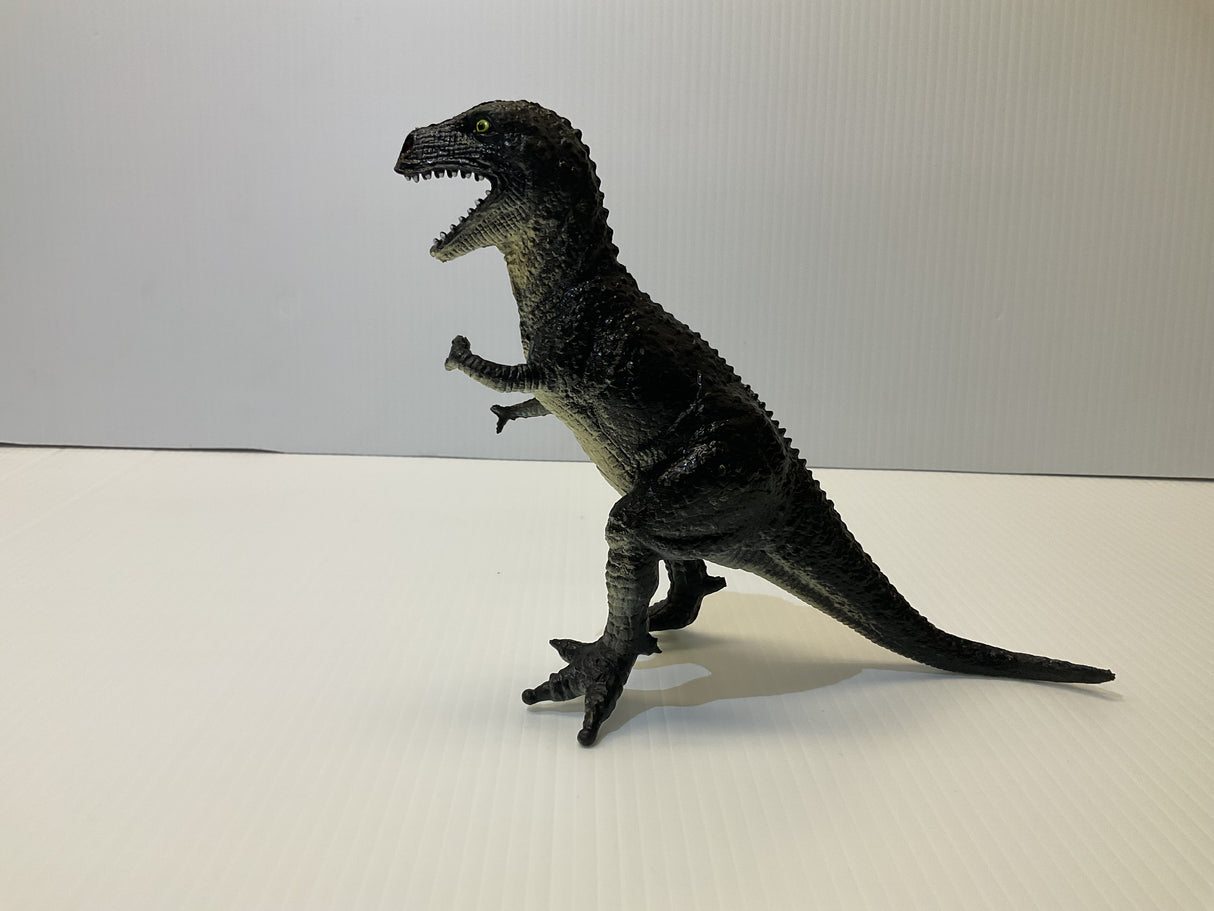 Black T-Rex dinosaur toy figure standing on a white surface for Mamejo MAJ33000