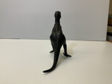 Black T-Rex dinosaur model standing on a white surface for Mamejo MAJ33000, rear view